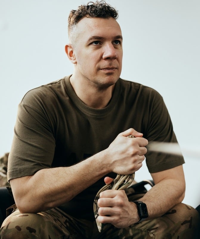 Image of a man holding a rope